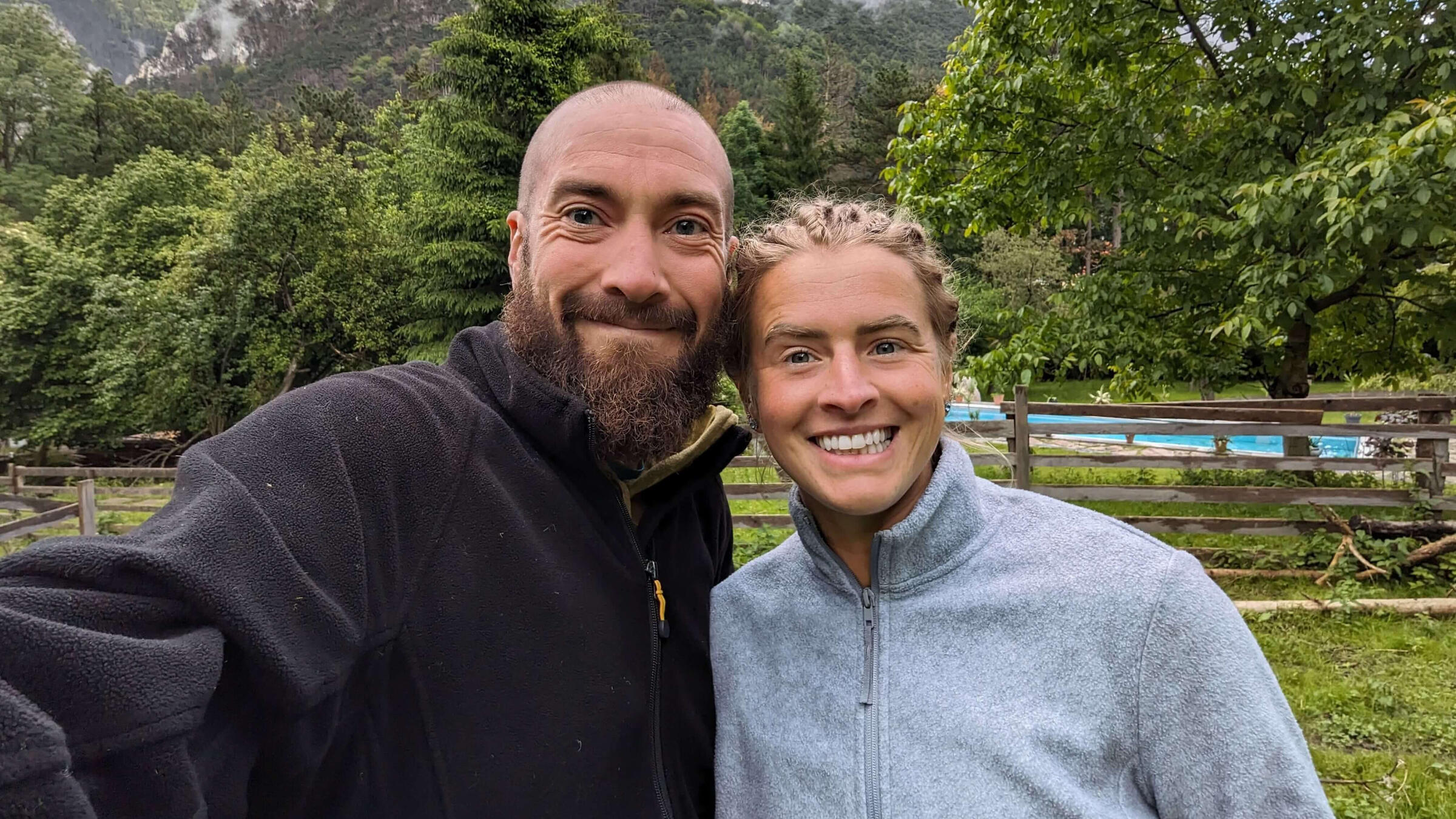 A picture of a couple on a farm in the mountains in Austria